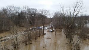 Flash Flood Sends Mud Past Golf Course, Swamps Homes